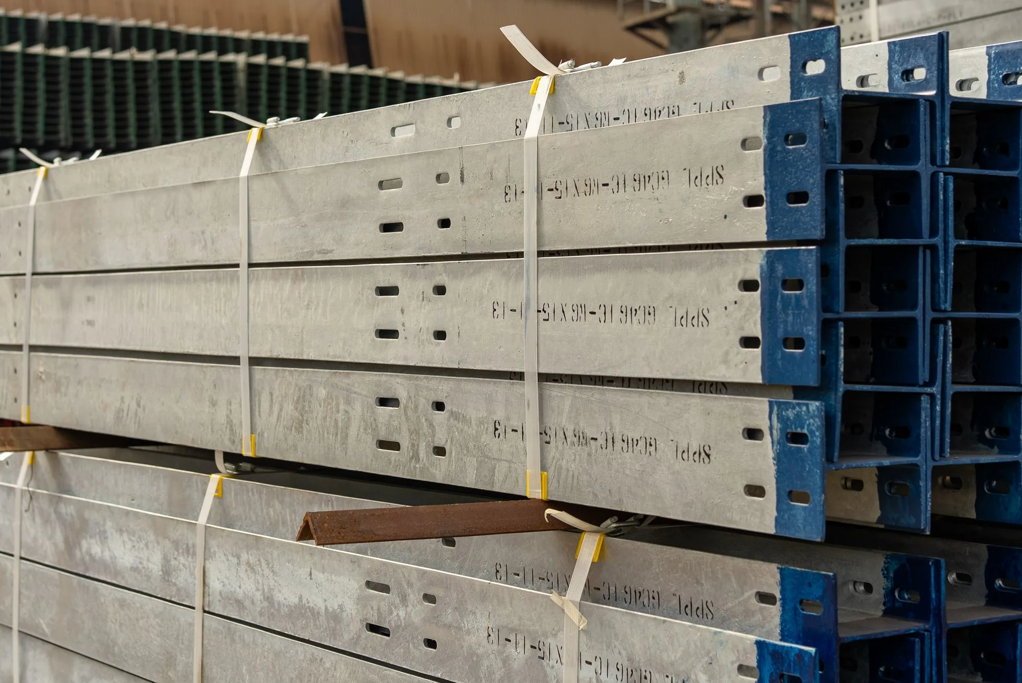 Long industrial sections held in bundles with narrow plastic straps